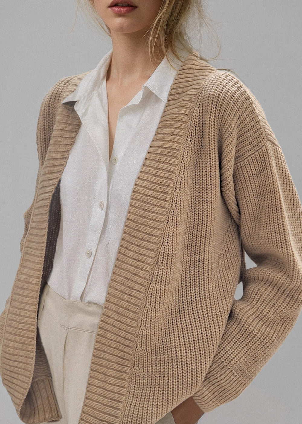 Three-quarter side view of the Brio Beige knit sweater.